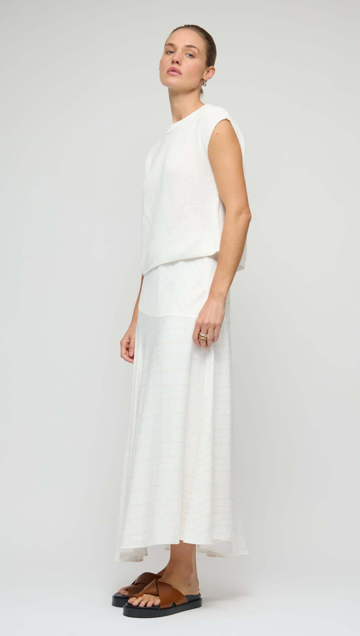 Cotton Blend White Knit Tank Top worn with a matching white skirt, showcasing a relaxed and modern layered look.