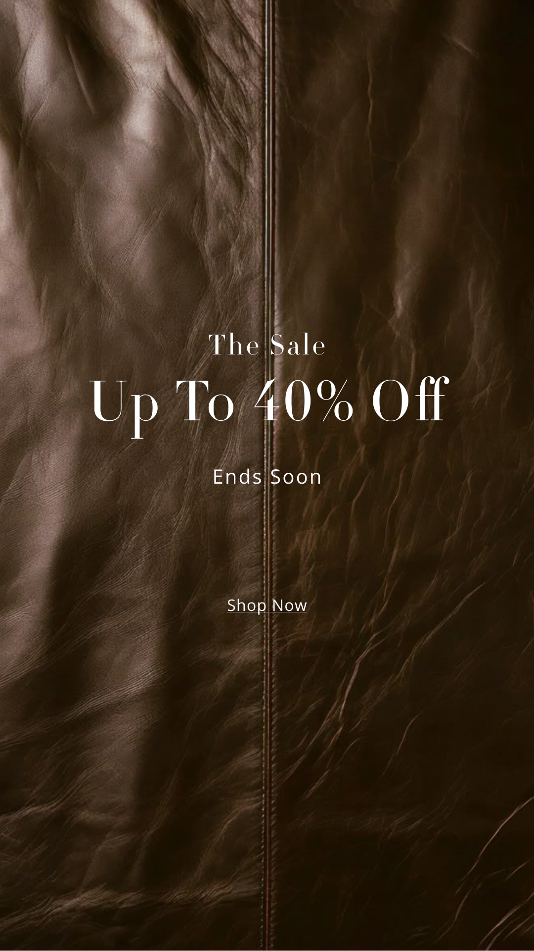 Brown leather jacket with promotional text overlay 'Up To 40% Off' on a dark background