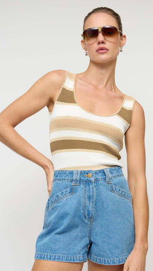 Model wearing NOA DENIM SHORTS paired with a striped tank top and sunglasses, showcasing a stylish summer outfit.