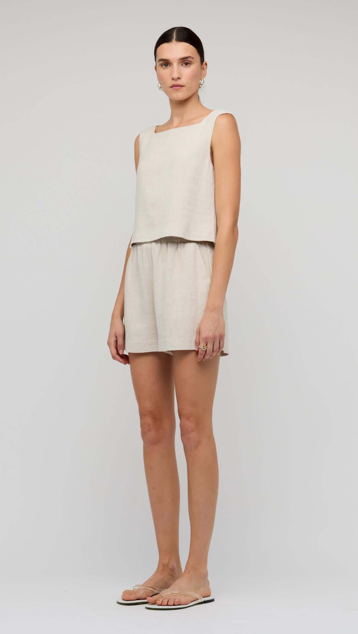 Natural Marle Relaxed Linen Shorts styled with a matching cropped top for a chic summer outfit.