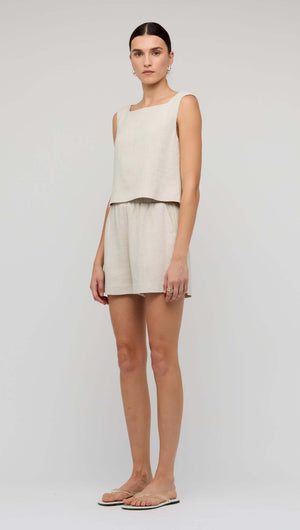 Model wearing Natural Marle Relaxed Linen Shorts with matching top, showcasing a casual summer outfit.