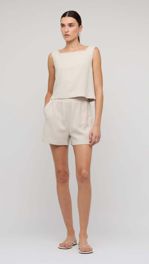 Natural Marle Relaxed Linen Shorts styled with a matching cropped top for a chic summer outfit.