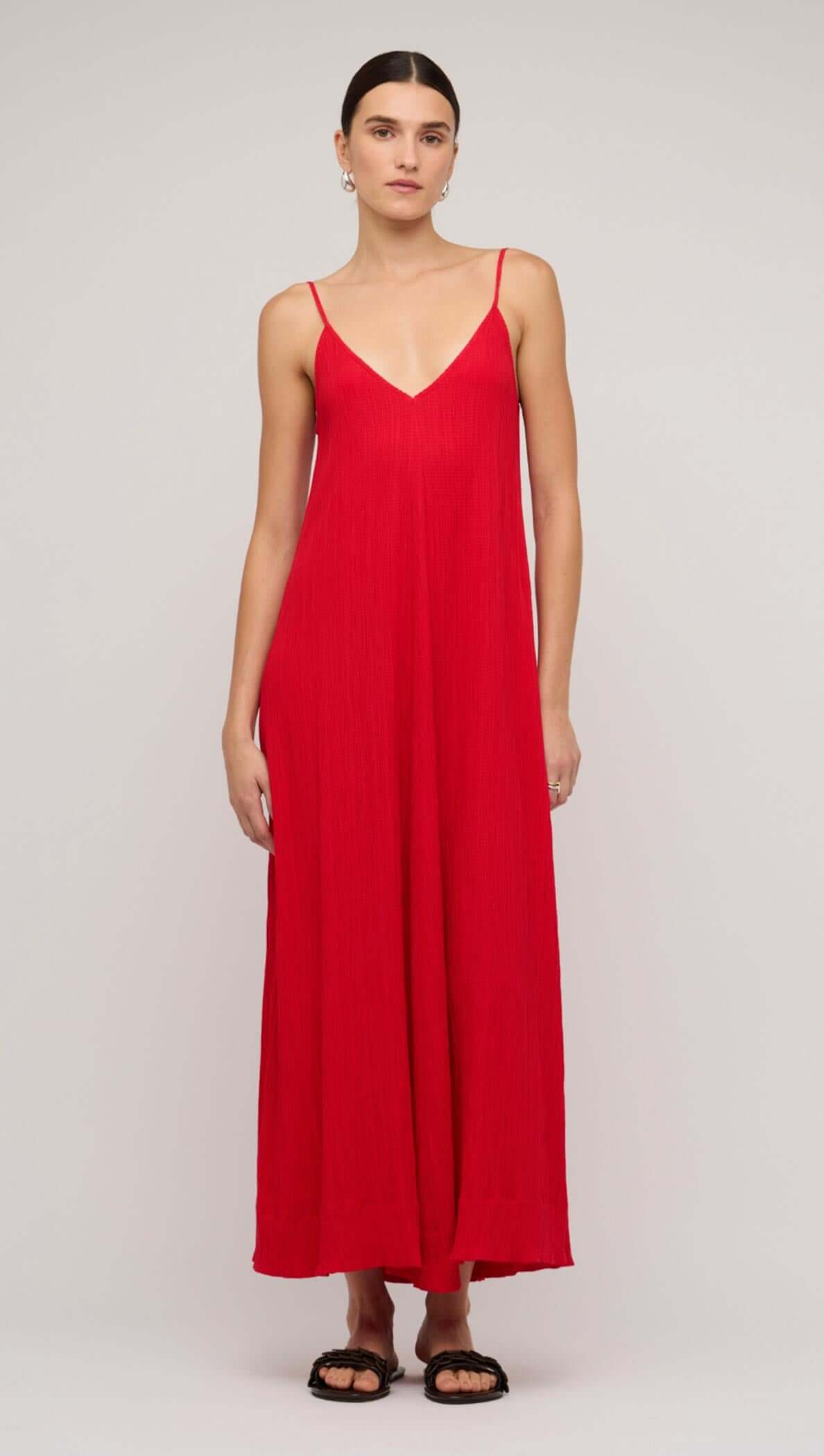 Model wearing a red crepe V-neck floaty maxi dress, showcasing a relaxed fit and summer style.