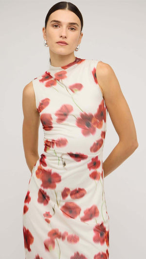 Model wearing a red and white poppy print mesh midi dress with a fitted silhouette and high neckline.