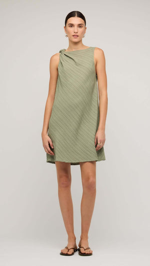 Sage green mini dress with tie waist, featuring a modern design and relaxed fit, perfect for casual outings.