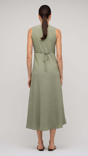 Back view of a sage green V-neck bias midi dress showcasing its elegant fit and tie detail.
