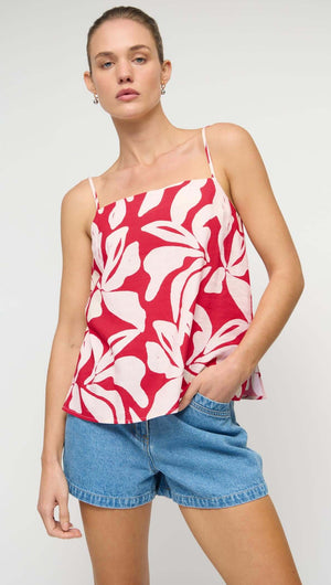 Cotton Blend Red & White Floral Print Cami Top worn with denim shorts, featuring adjustable tie-back detailing and spaghetti straps.