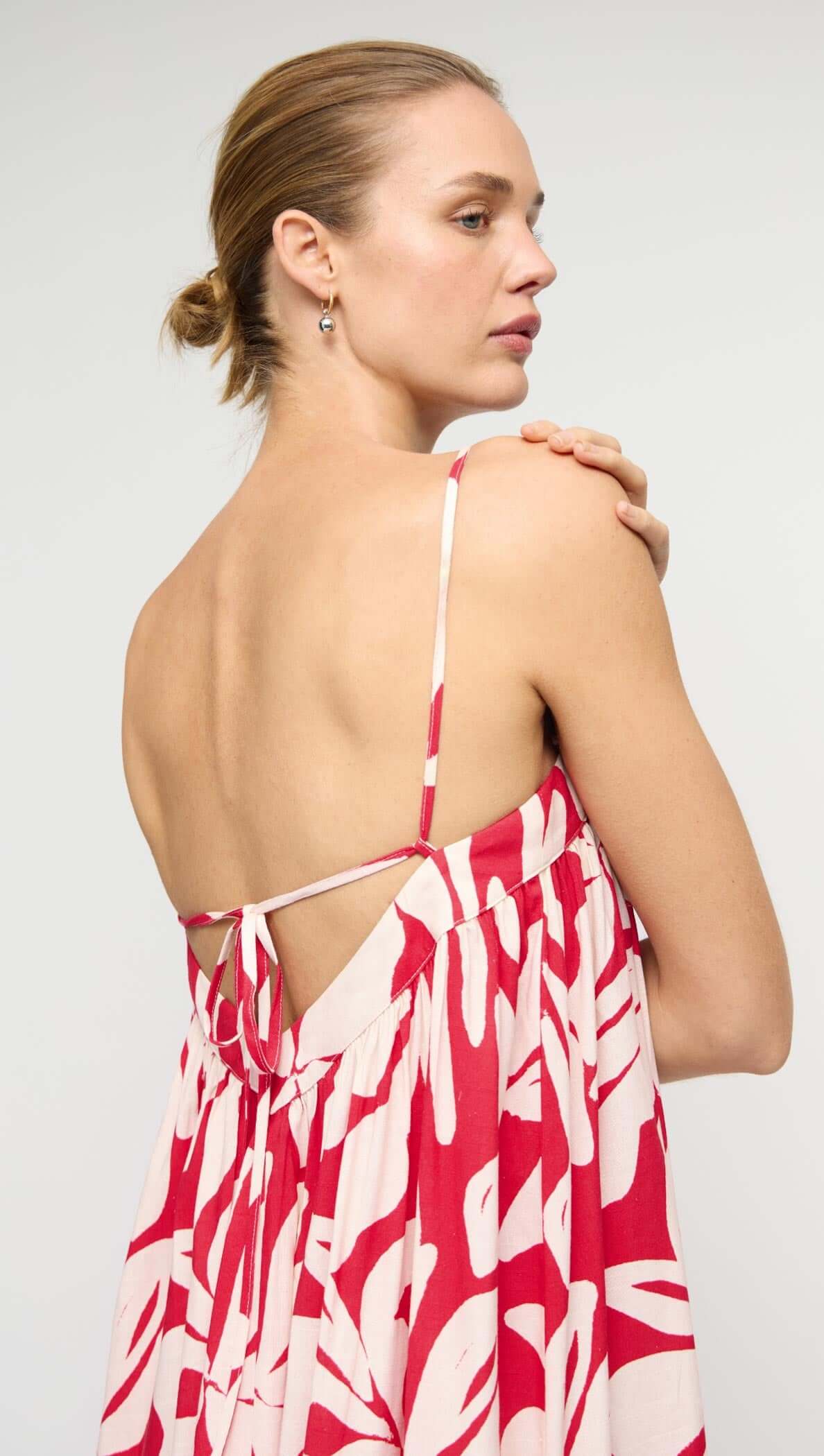 Model wearing Cotton Blend Red & White Floral Print Maxi Dress, a flowy summer outfit with a relaxed silhouette.