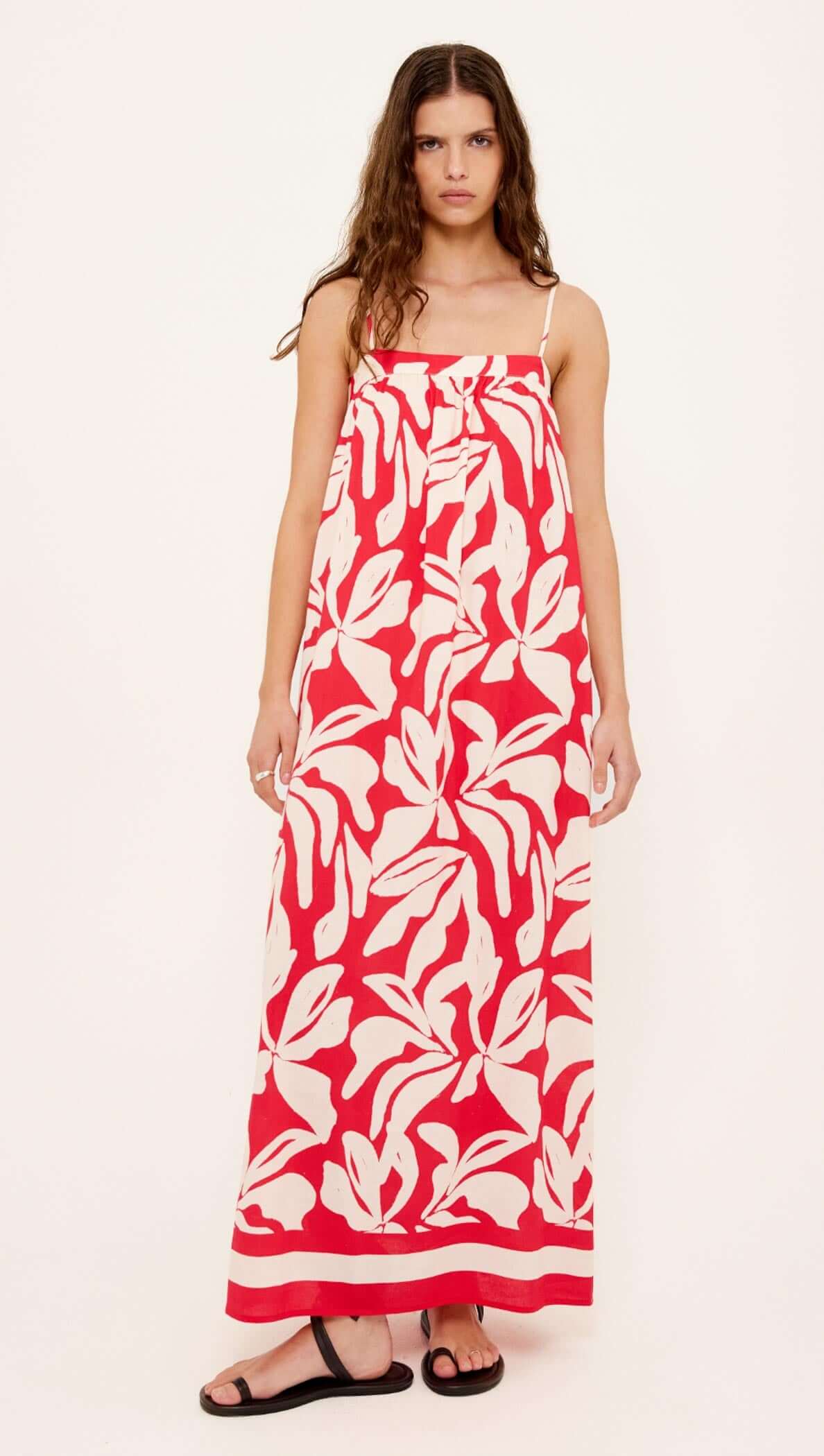 Cotton Blend Red & White Floral Print Maxi Dress on a model, featuring a relaxed silhouette and adjustable tie-back detail.