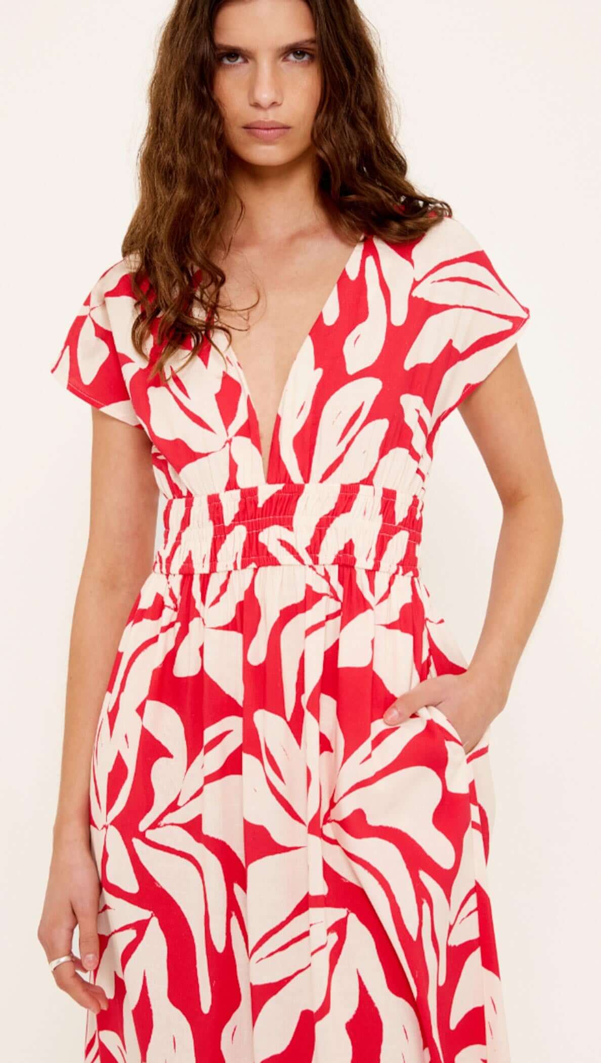Cotton Blend Red & White Floral Print Shirred Midi Dress on model showcasing deep V neckline and shirred waist.