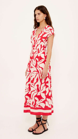 Cotton Blend Red & White Floral Print Shirred Midi Dress displayed on a model, featuring a deep V neckline and shirred waist.