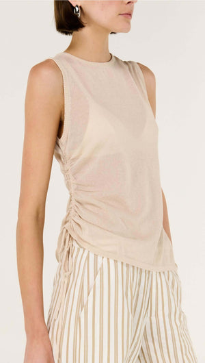 Sheer Drawstring Knit Tank Top with adjustable side ruching, styled with striped pants.