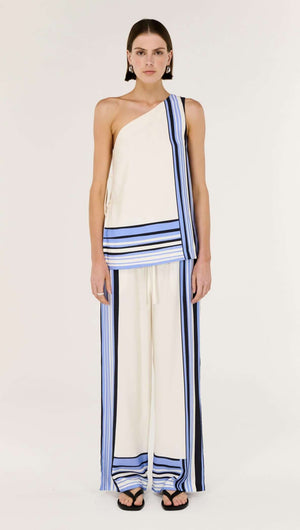 Model wearing Stripe Relaxed Wide-Leg Low Rise Pants with a matching top featuring spliced stripe detailing.