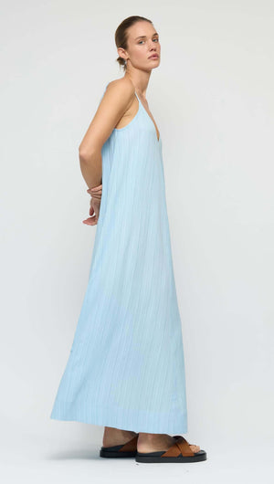 Sky Blue Crepe V-Neck Floaty Maxi Dress displayed on a model, showcasing its relaxed silhouette and soft V-neckline.