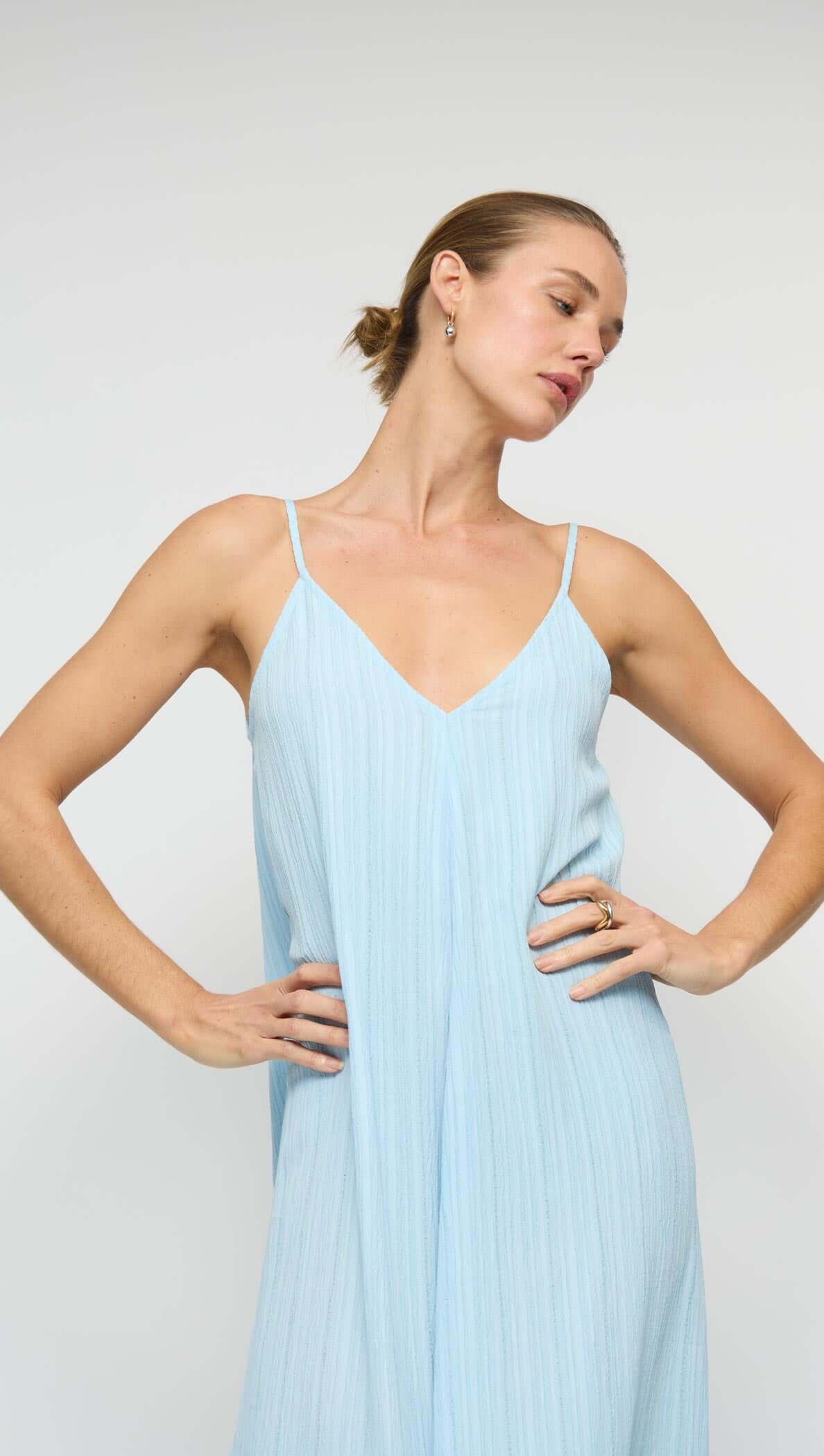 Sky Blue Crepe V-Neck Floaty Maxi Dress on a model showcasing the relaxed, flowy silhouette and slim adjustable straps.