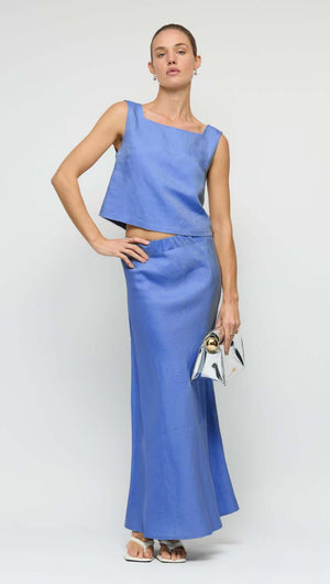 Model showcasing the Jacaranda Tencel Linen Blend Maxi Skirt in cobalt blue with matching top and stylish accessories.