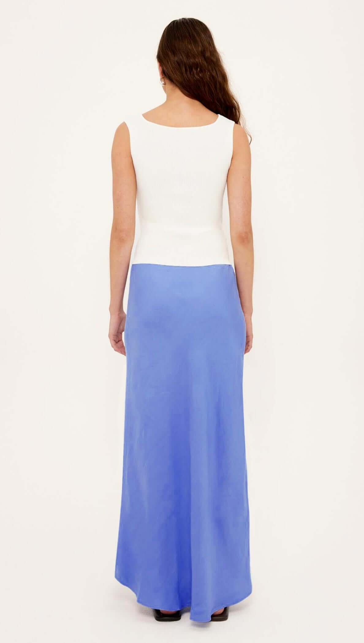 Back view of a model wearing the Jacaranda Tencel Linen Blend Maxi Skirt in cobalt tone.