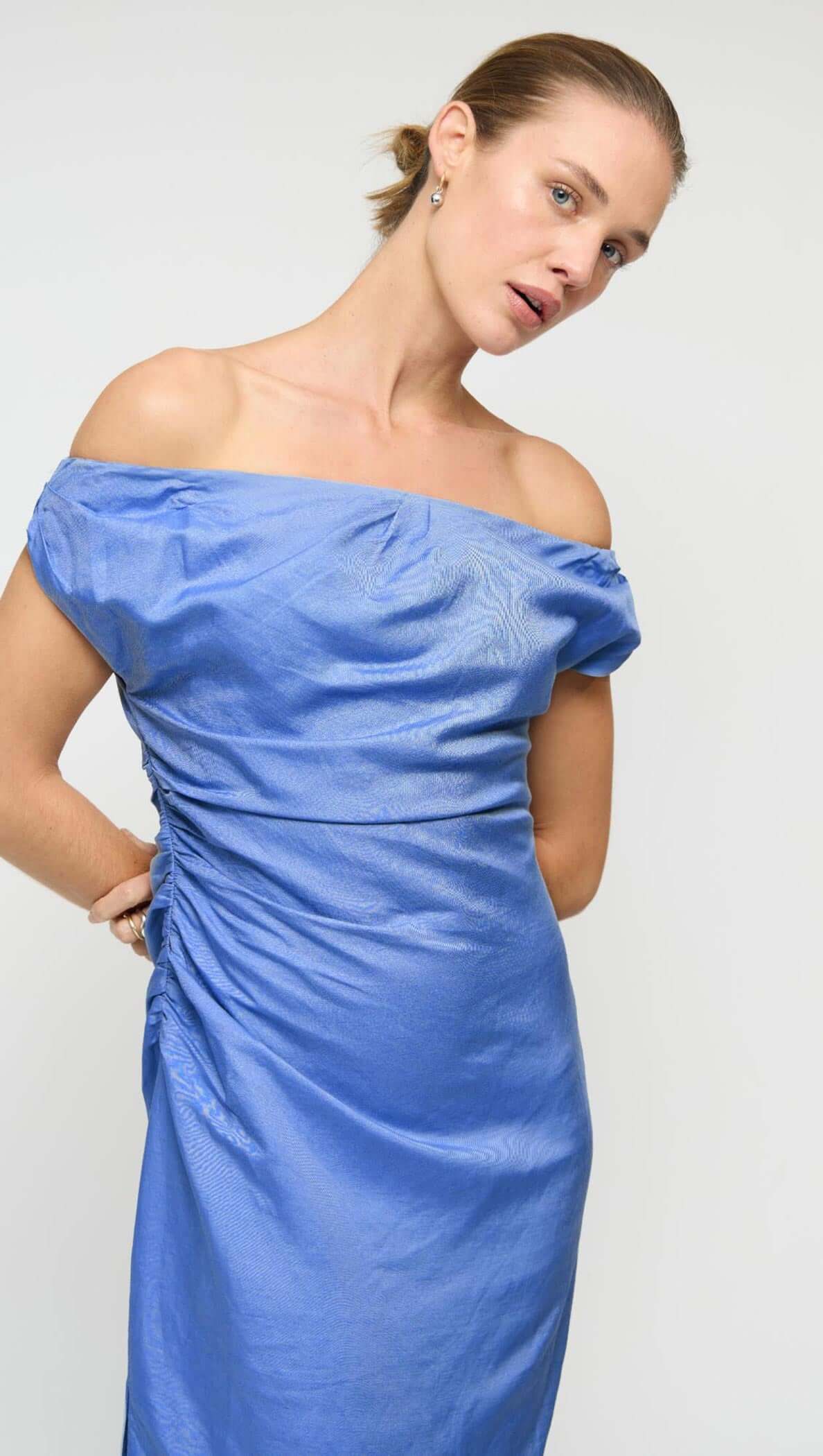 Jacaranda Tencel Linen Blend Off-Shoulder Midi Dress in jacaranda blue, featuring off-shoulder neckline and side ruching.