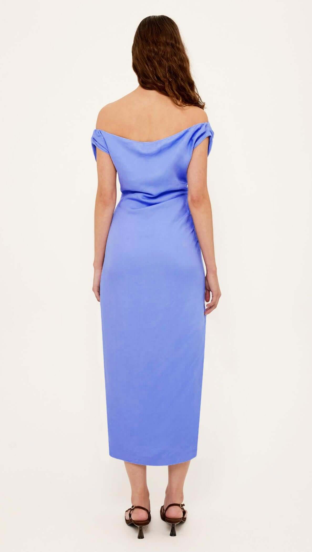 Back view of the Jacaranda Tencel Linen Blend Off-Shoulder Midi Dress in jacaranda blue, featuring a sleek straight silhouette.
