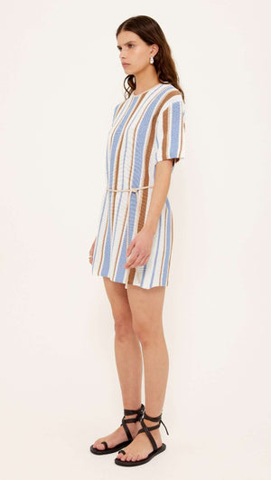 Striped Knit T-Shirt Mini Dress shown on a model, featuring a relaxed fit and coastal-inspired striped pattern.