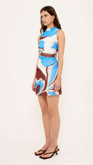 Blue Abstract Mesh Mini Dress worn by a model, featuring a high neckline and ruched waist in an eye-catching abstract print.