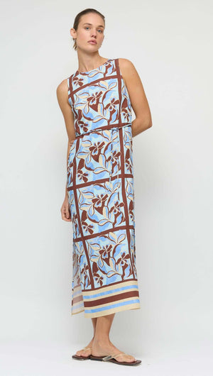Blue Abstract floral Midi Dress with Tie Waist worn by a model, featuring bold blue and chocolate patterns.