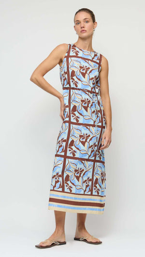 Blue Abstract floral Midi Dress with Tie Waist modeled on a woman, showcasing a sleeveless design and vibrant floral pattern.