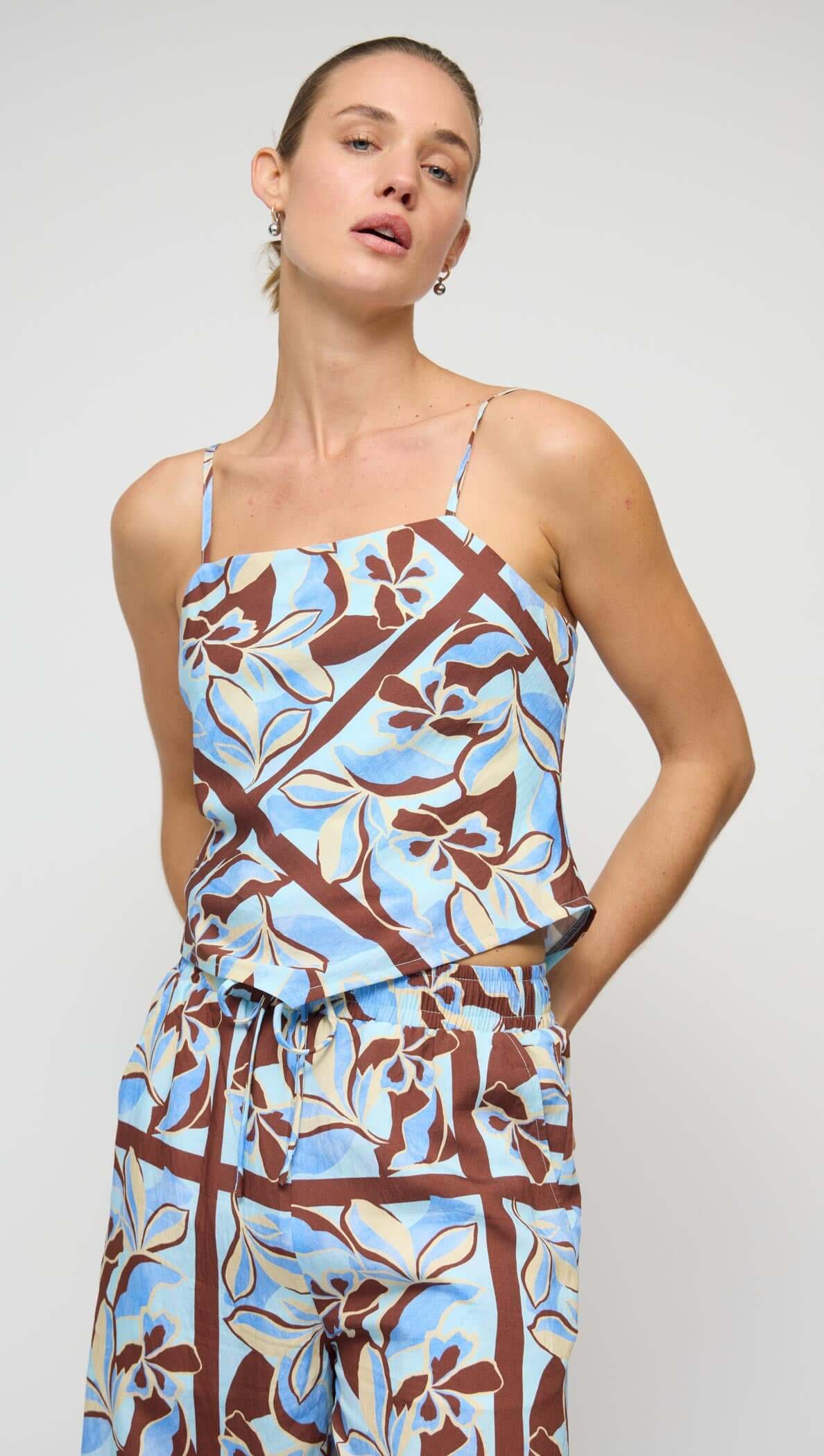Blue Abstract floral Scarf Cami Top featuring a soft draped neckline and adjustable straps in a vibrant floral print.