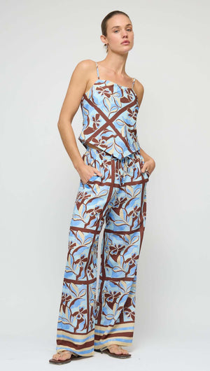 Blue Abstract floral Scarf Cami Top modeled with matching pants, showcasing a contemporary summer outfit.