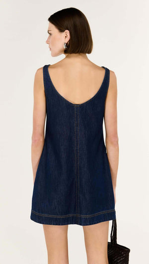 Back view of the Denim Mini Dress with Scoop Back, showcasing its sleeveless design and flattering A-line shape.