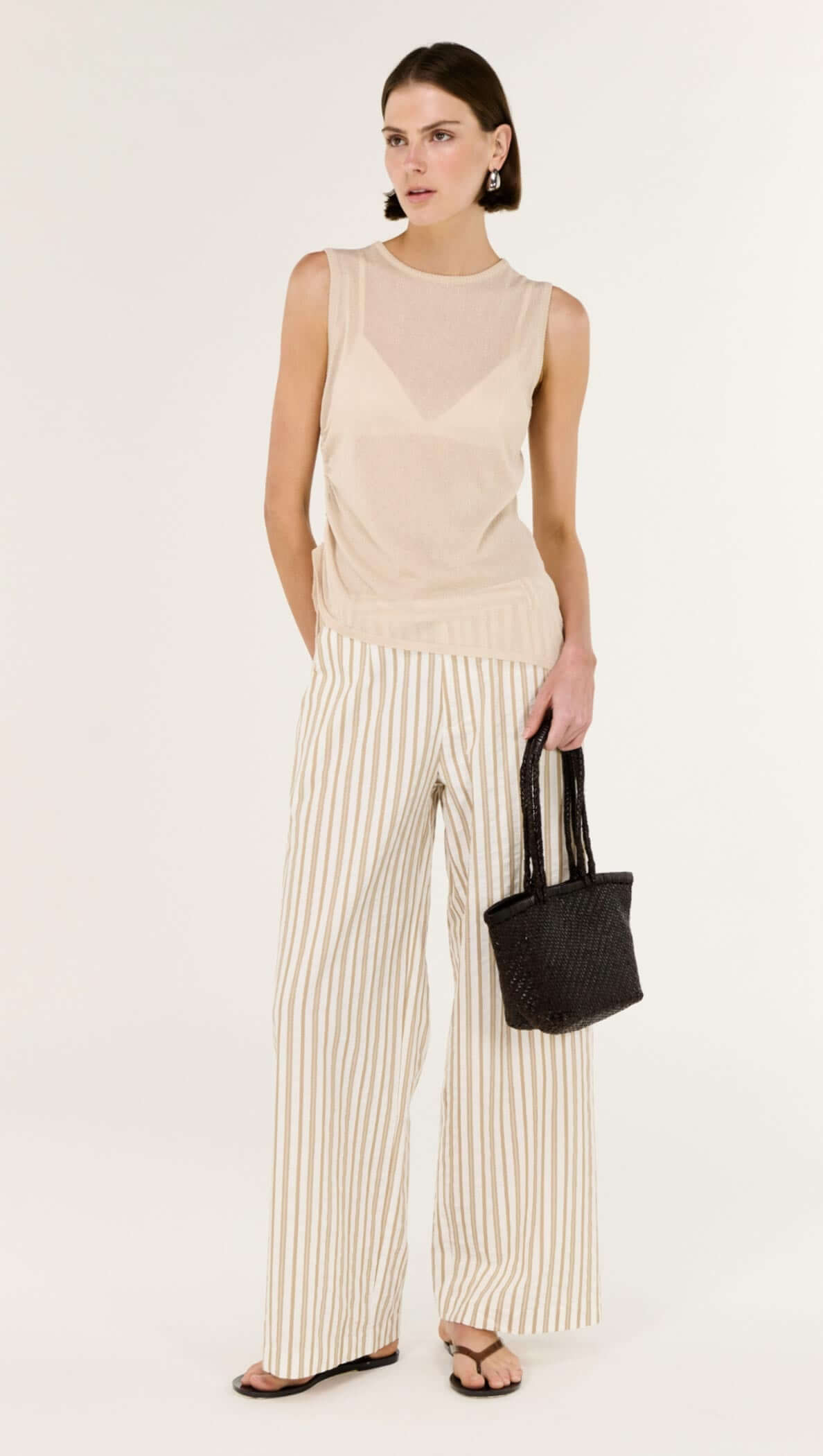 Model wearing Cotton Blend Stripe Mid-Rise Pants with a matching striped top, showcasing a relaxed, wide-leg silhouette.