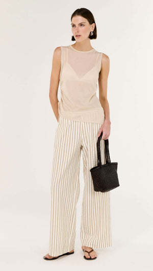 Model wearing Cotton Blend Stripe Mid-Rise Pants with a neutral top and black bag, showcasing a relaxed wide-leg fit.