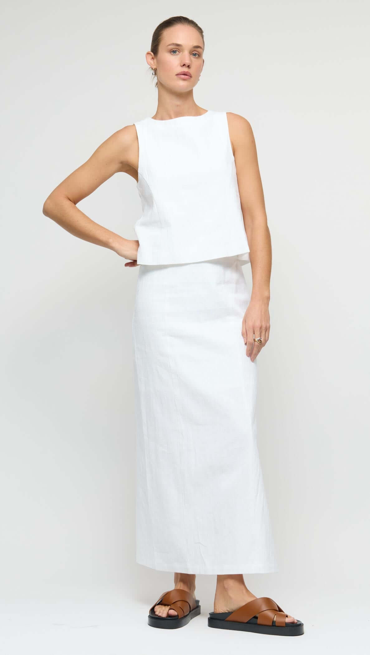 Linen Cotton Blend White Midi Skirt worn with a sleeveless top showcasing a clean, minimalist style.
