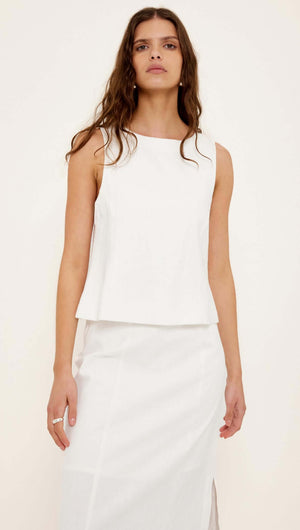 Linen Cotton Blend White Top on model, showcasing a stylish sleeveless design and structured silhouette.