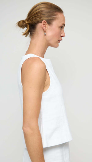 Linen Cotton Blend White Top showcased on a model, highlighting the elegant sleeveless design and structured silhouette.