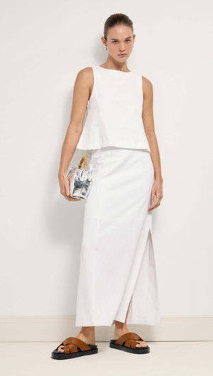 Linen Cotton Blend White Top showcased in a stylish outfit, featuring a sleeveless design and elegant silhouette.