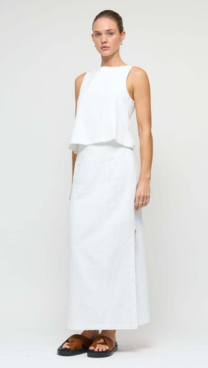 Linen Cotton Blend White Top worn by model, showcasing a stylish sleeveless design and structured silhouette.