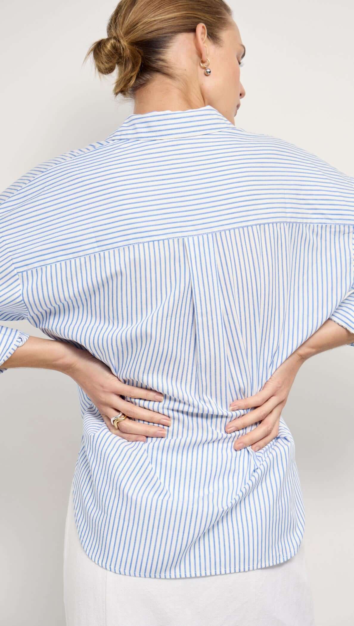 Cotton Blue & White Oversized Shirt showcasing a stylish back view with blue and white stripes and a relaxed fit.