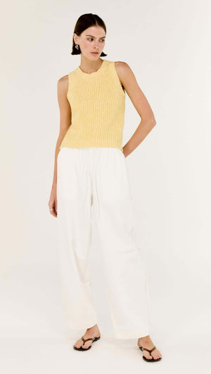 Model wearing White Cotton Relaxed Wide-Leg Pant paired with a yellow top, showcasing a casual and chic style.