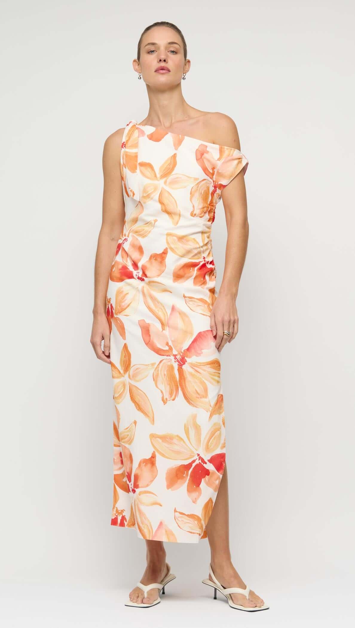 Orange & White Floral Asymmetric Midi Dress worn by model, featuring one-shoulder design and floral print.