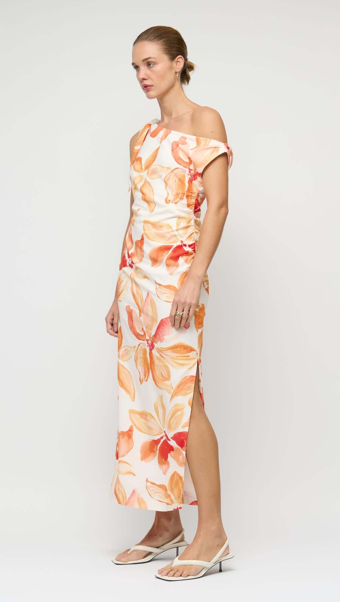 Orange & White Floral Asymmetric Midi Dress showcasing a one-shoulder design with floral print and side split hem.