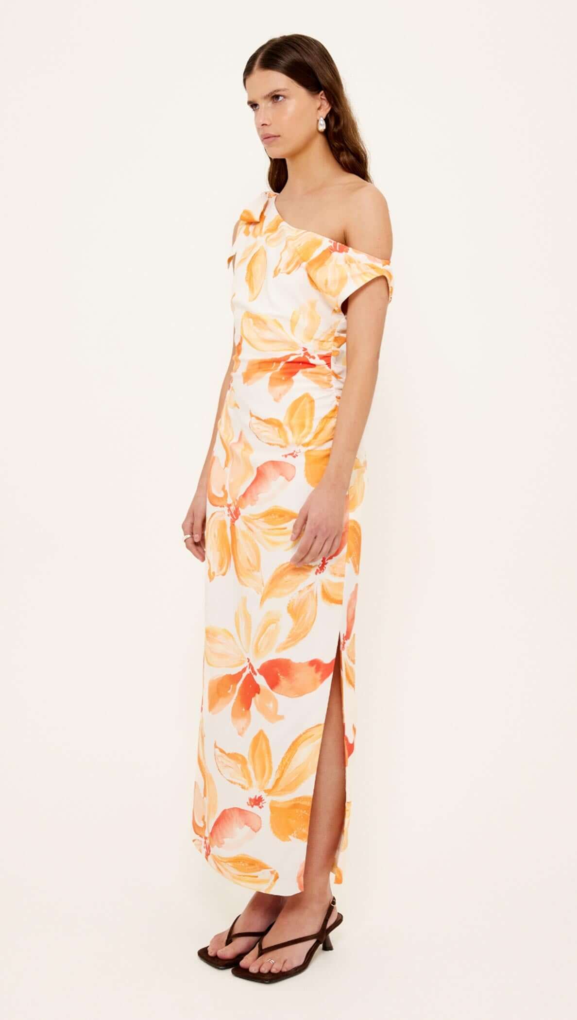 Orange & White Floral Asymmetric Midi Dress worn by a model showcasing a one-shoulder design and side split.