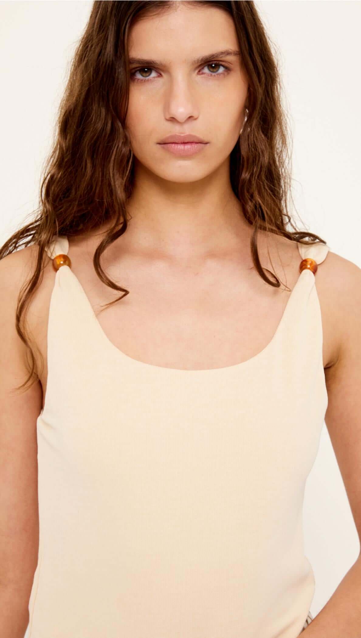 Tan Stretch Tank with Bead Detail featuring beaded shoulder accents and soft ribbed knit texture.