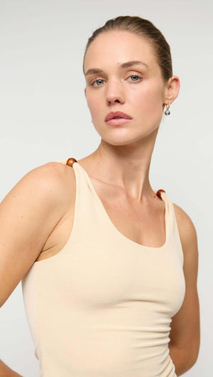 Tan Stretch Tank with Bead Detail featuring a scoop neckline and beaded shoulder accents.