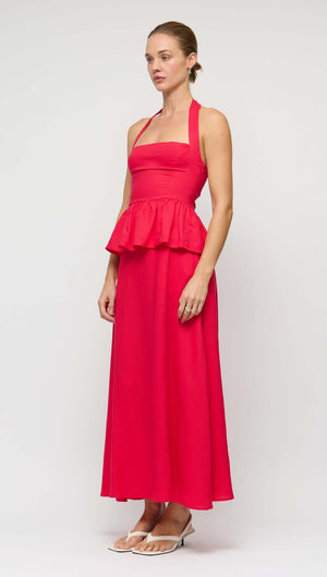 Red Linen Blend Maxi Skirt featuring a high-waisted fit and fluid silhouette, model standing elegantly.