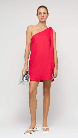 Model wearing a Red Linen Blend One Shoulder Mini Dress with oversized shoulder tie and A-line silhouette.