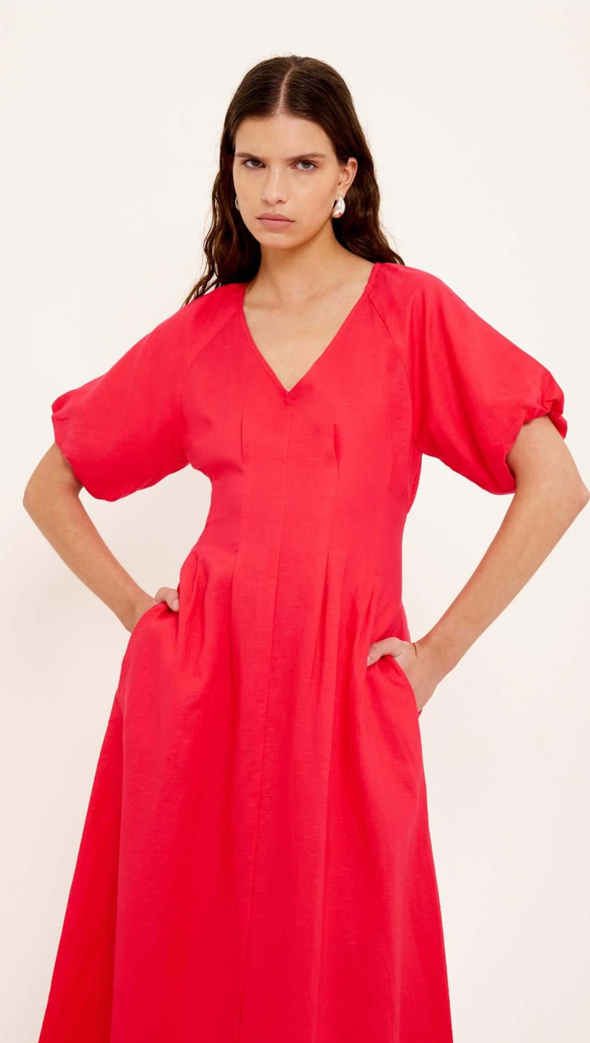 Red Linen Blend v-Neck Midi Dress on model with short puff sleeves and a relaxed fit.