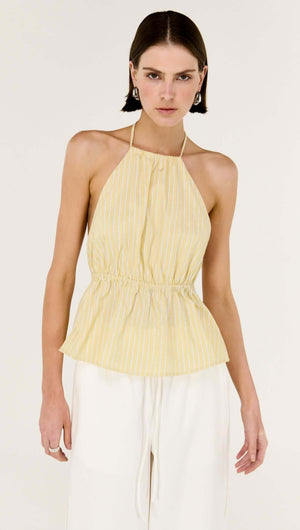 Butter Yellow Low Back Striped Halter Top on model showcasing halter neckline and peplum waist design.