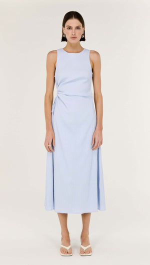 Baby Blue Cotton Textured Cut Out Midi Dress on a model featuring a sleek sleeveless design and subtle side cut-out.