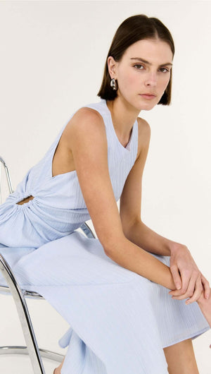 Model wearing the Baby Blue Cotton Textured Cut Out Midi Dress, showcasing its elegant design and side cut-out detail.